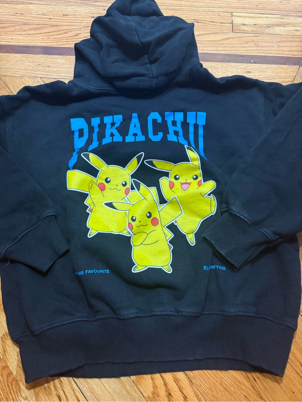 Zara Black Hoodie with Bright Yellow Pikachu Graphic and Blue Lettering